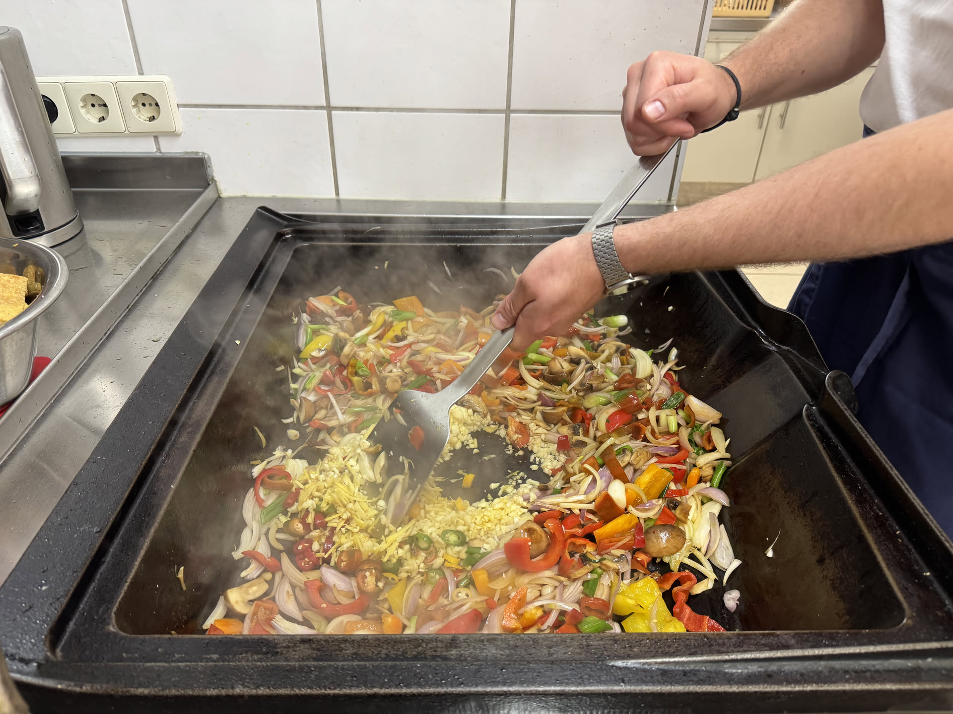 The first ingredients in a large cooking pan
